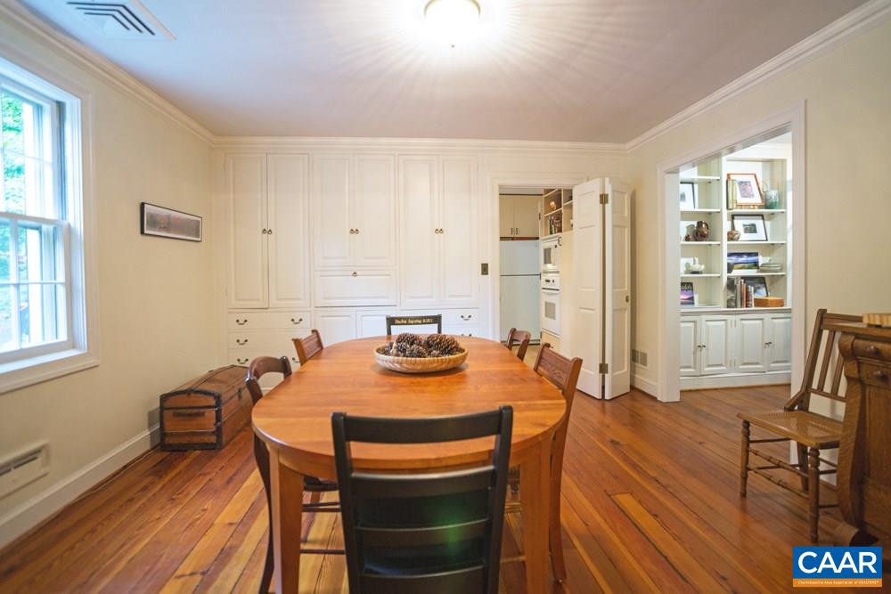 2040 Thomson Road Charlottesville, VA 22903 - Photo 8 of 23 a view of a dining room with furniture and wooden floor