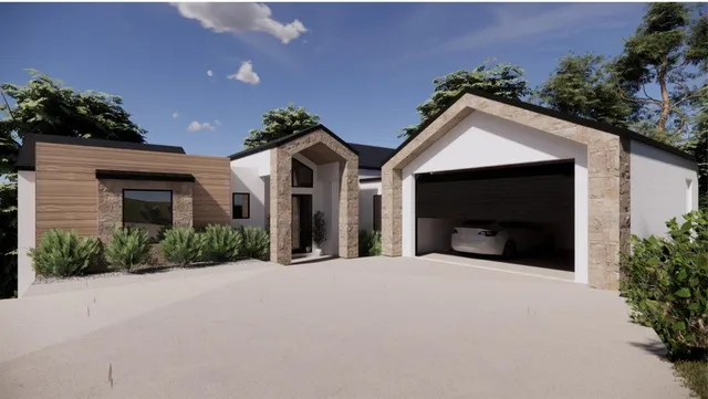a view of a house with a yard and potted plants