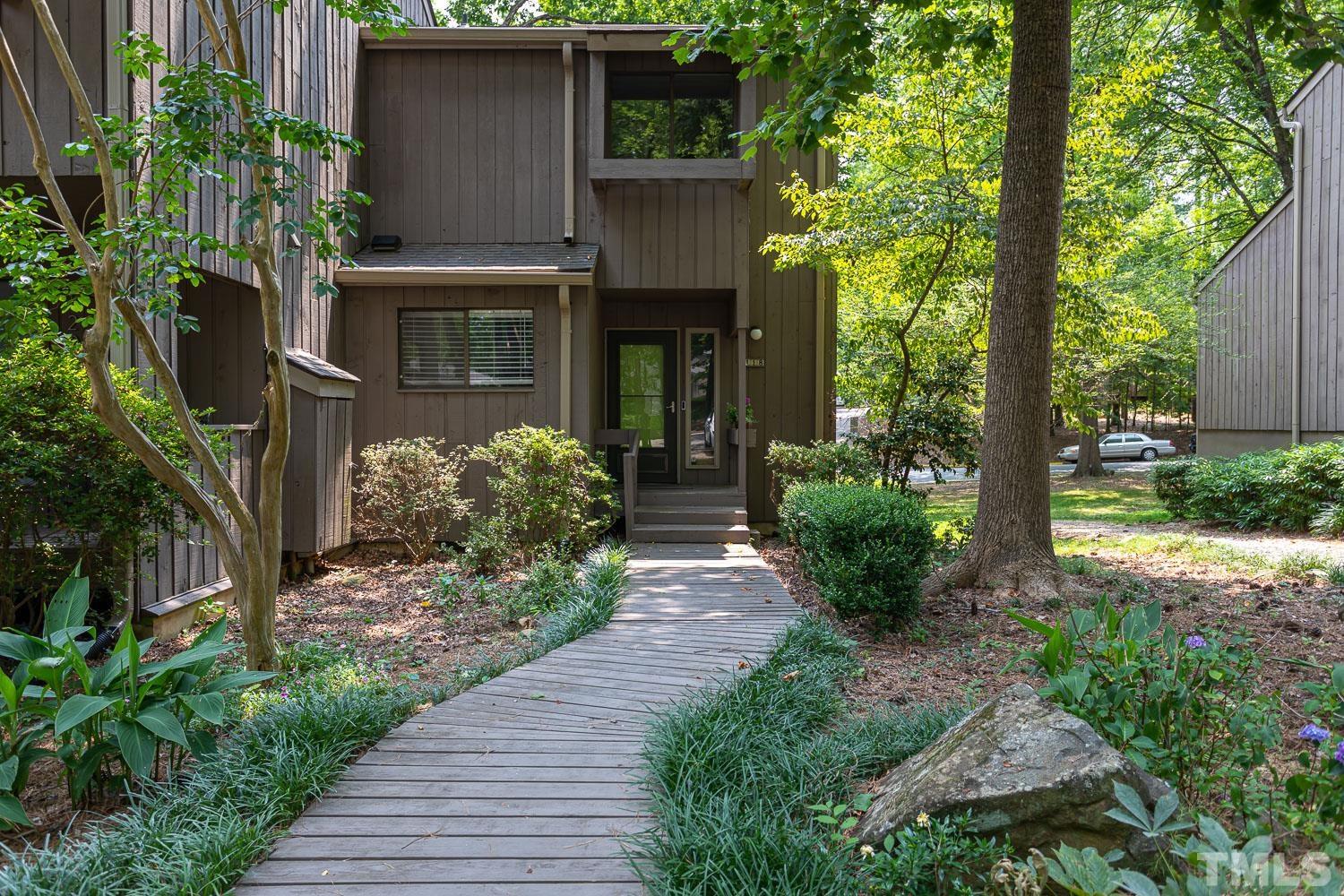 118 Ridge Trail Chapel Hill, NC 27516 - Photo 1 of 31 a front view of a house with garden