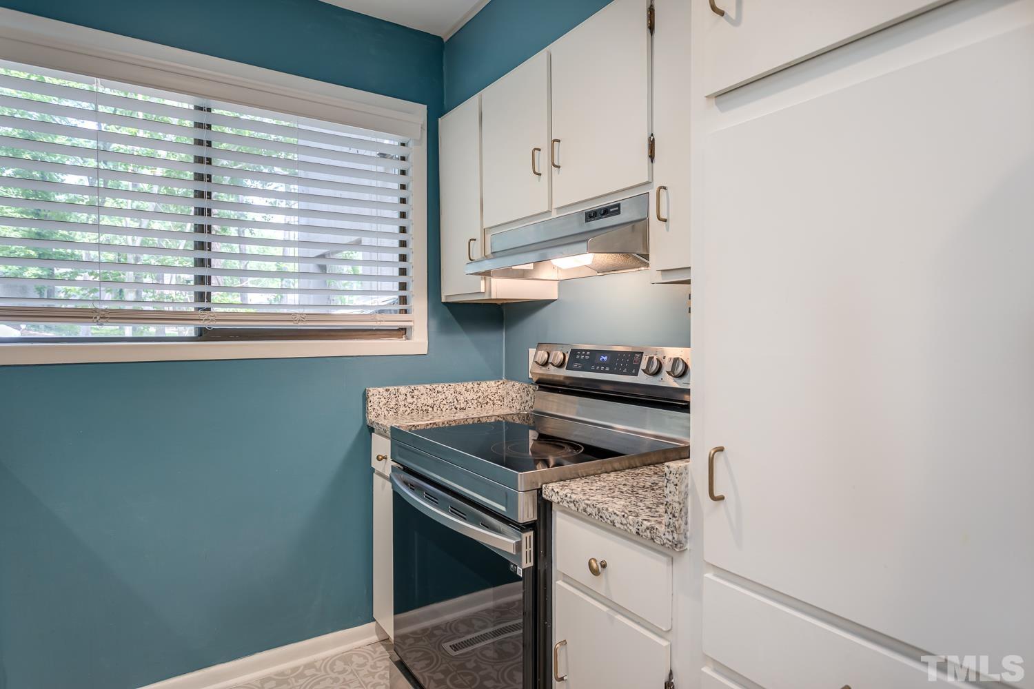118 Ridge Trail Chapel Hill, NC 27516 - Photo 11 of 31 a kitchen with a stove and a window