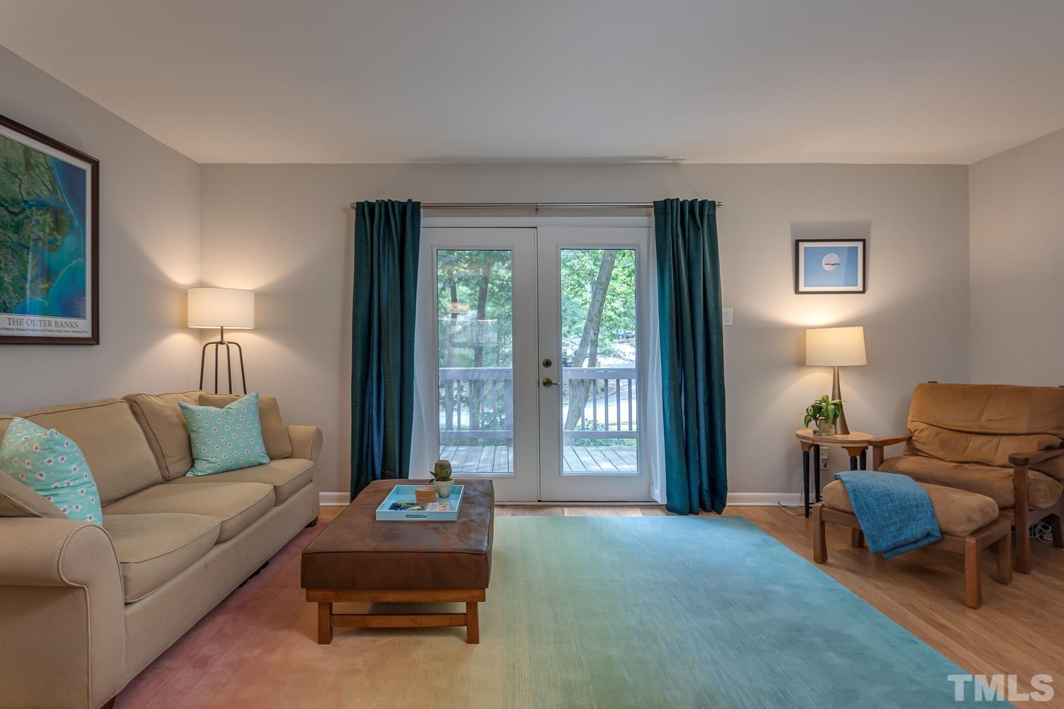 118 Ridge Trail Chapel Hill, NC 27516 - Photo 13 of 31 a living room with furniture and a lamp