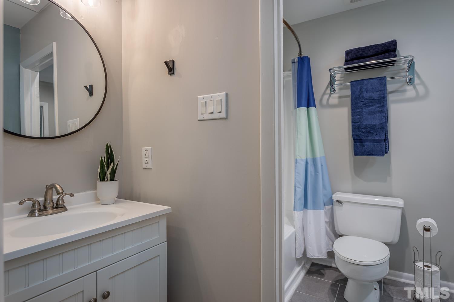 118 Ridge Trail Chapel Hill, NC 27516 - Photo 16 of 31 a bathroom with a toilet sink and mirror