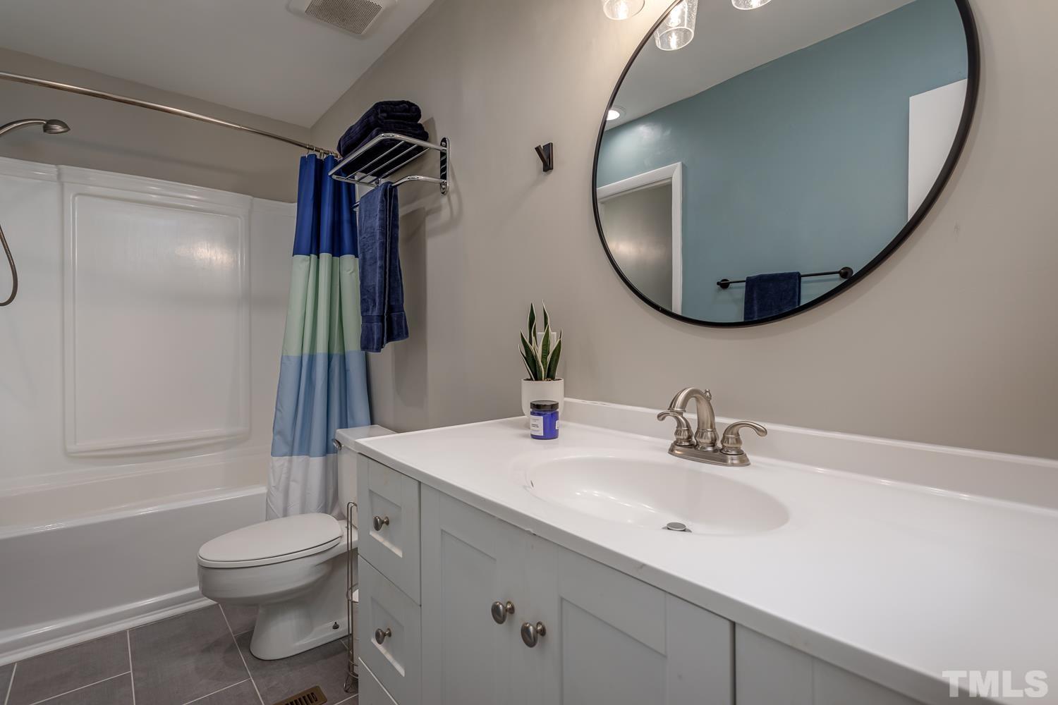 118 Ridge Trail Chapel Hill, NC 27516 - Photo 17 of 31 a bathroom with a toilet a sink and mirror