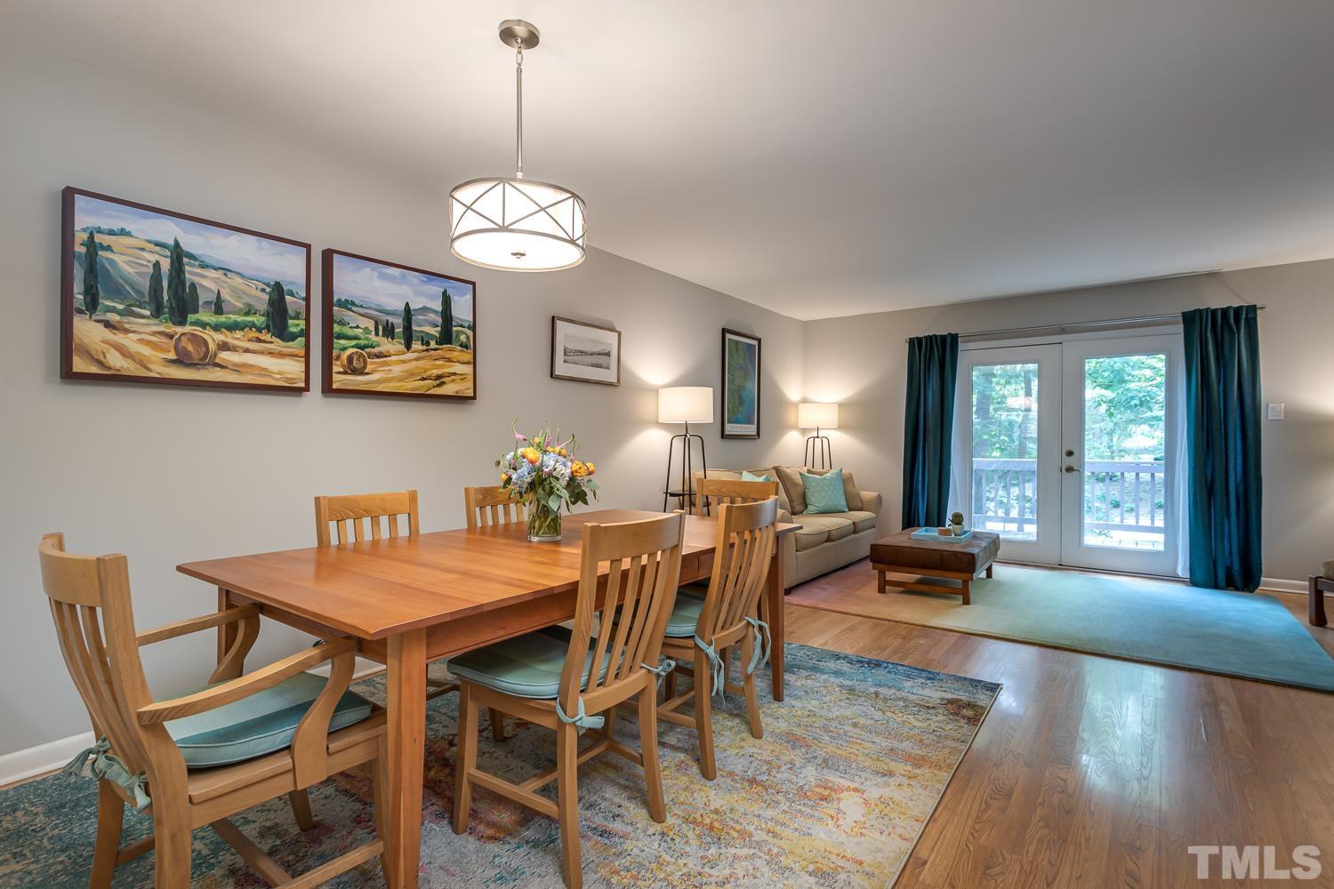 118 Ridge Trail Chapel Hill, NC 27516 - Photo 2 of 31 a view of a dining room with furniture a chandelier and wooden floor