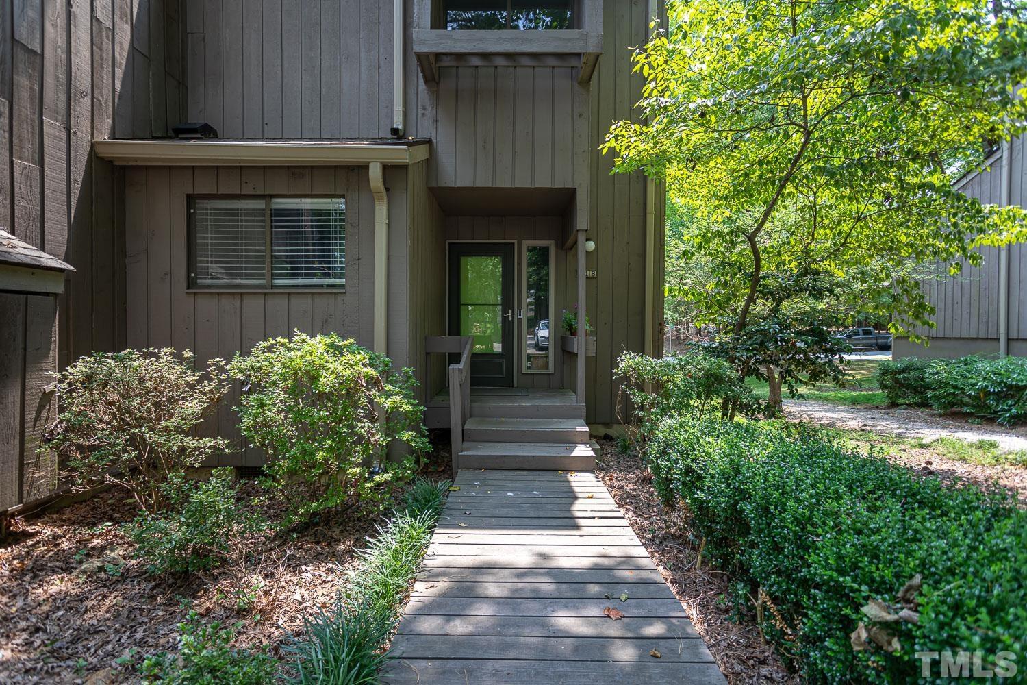 118 Ridge Trail Chapel Hill, NC 27516 - Photo 22 of 31 a view of a pathway of the house and potted plants