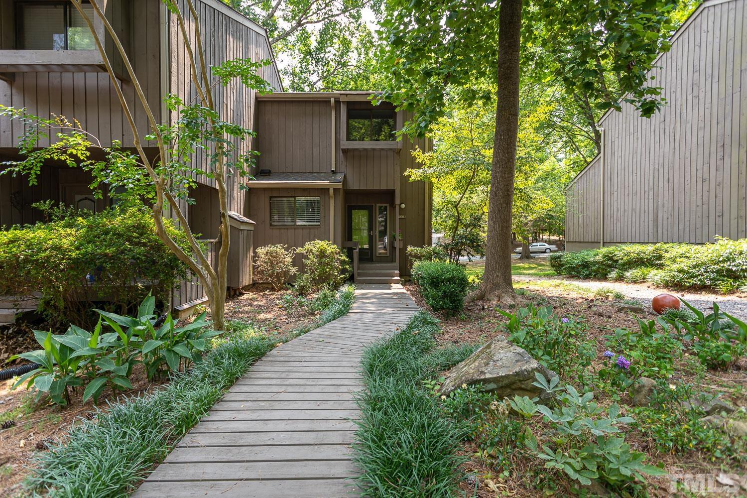 118 Ridge Trail Chapel Hill, NC 27516 - Photo 23 of 31 a front view of a house with garden