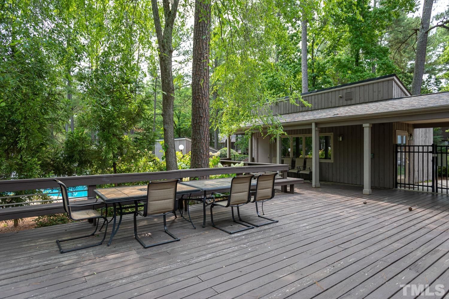 118 Ridge Trail Chapel Hill, NC 27516 - Photo 26 of 31 a view of a dinning table and chairs in patio of the house