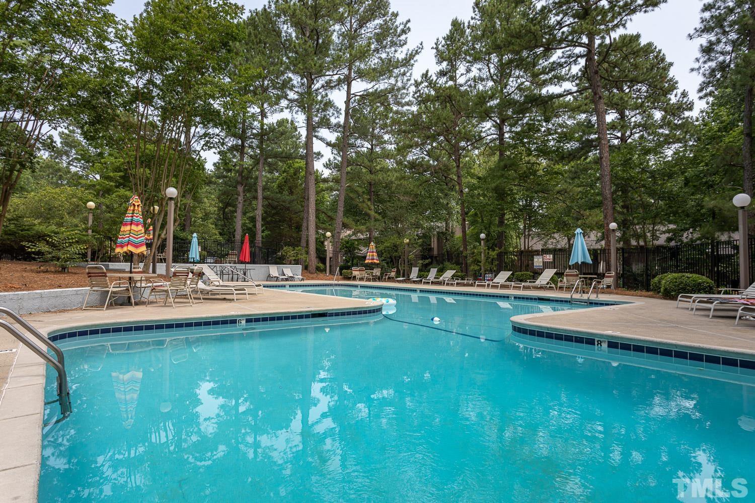 118 Ridge Trail Chapel Hill, NC 27516 - Photo 27 of 31 a view of swimming pool with outdoor seating and plants