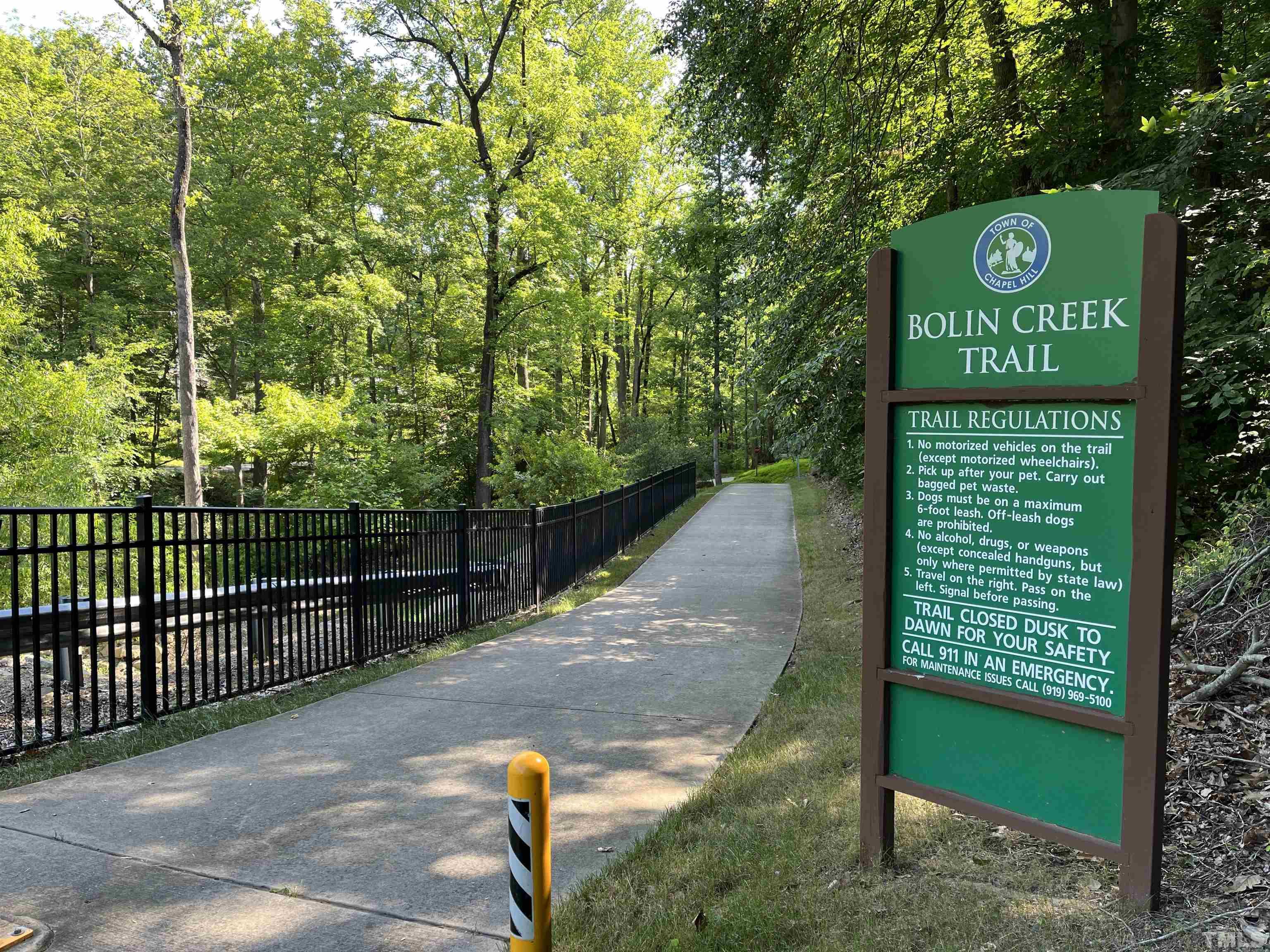 118 Ridge Trail Chapel Hill, NC 27516 - Photo 28 of 31 a view of a street with wooden fence