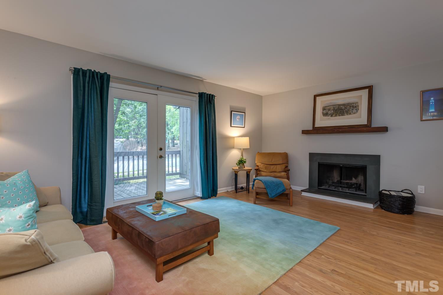 118 Ridge Trail Chapel Hill, NC 27516 - Photo 3 of 31 a living room with furniture and a fireplace