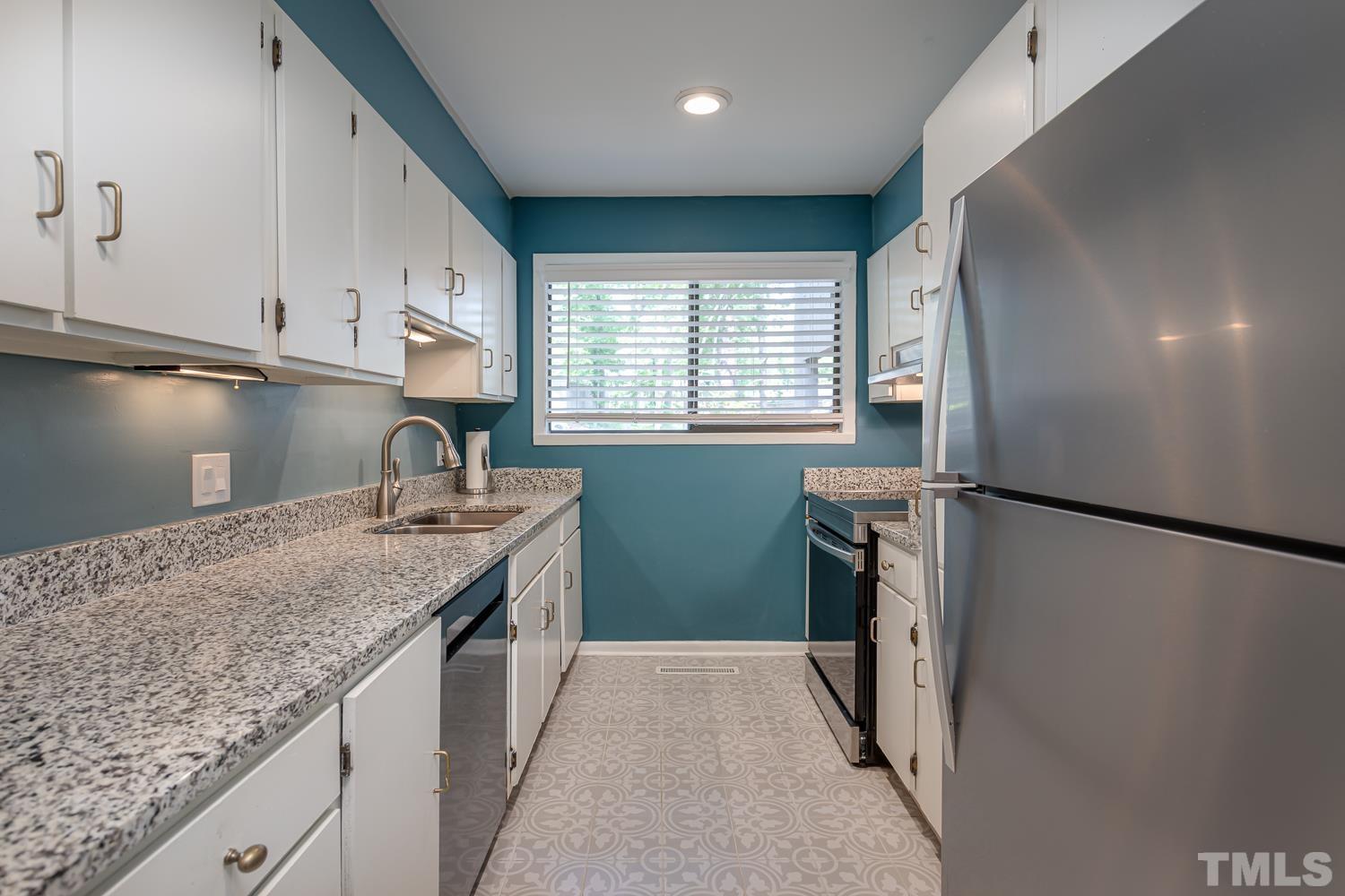 118 Ridge Trail Chapel Hill, NC 27516 - Photo 8 of 31 a kitchen with granite countertop a sink stove and refrigerator