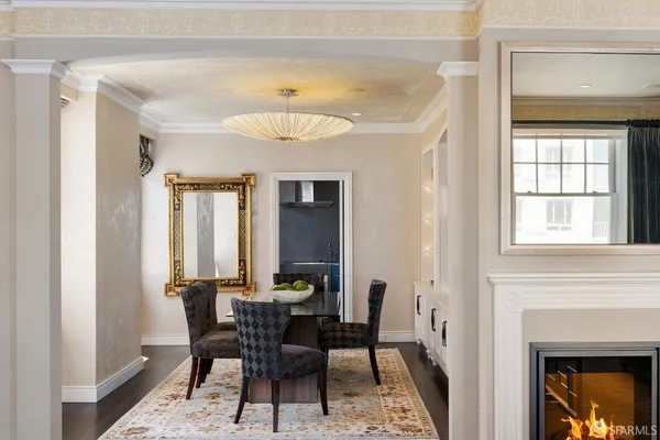 a view of a dining room with furniture and chandelier