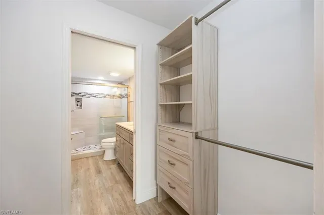 a view of bathroom with a toilet and a view of bathroom