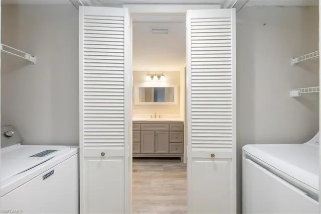 a bathroom with a window and washer