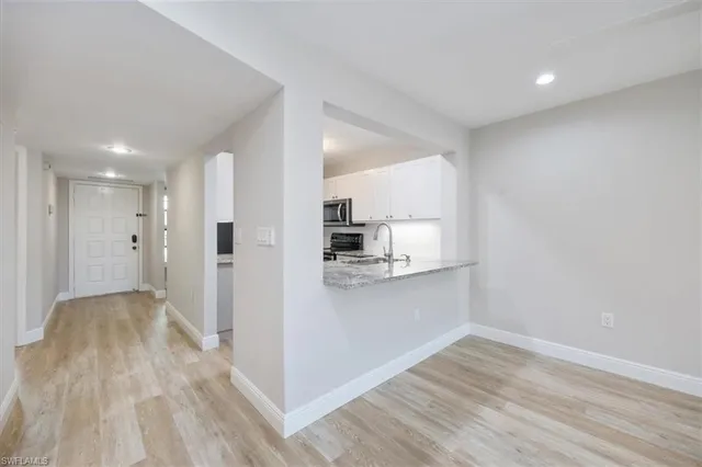 a view of kitchen with wooden floor