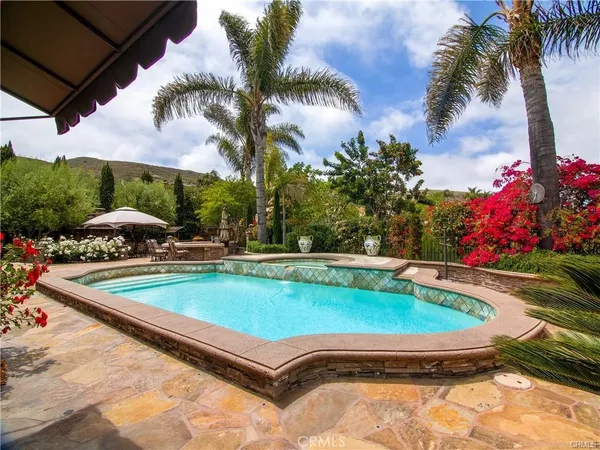 a view of swimming pool with a yard