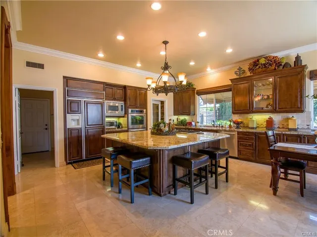 a kitchen with a stove and cabinets