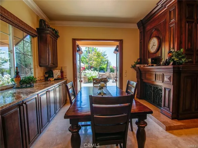 a living room with furniture ceiling fan and a fireplace