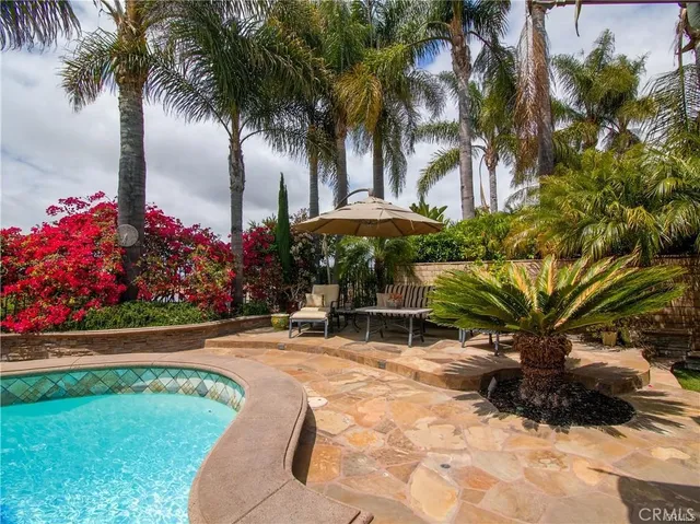 a view of swimming pool from a balcony