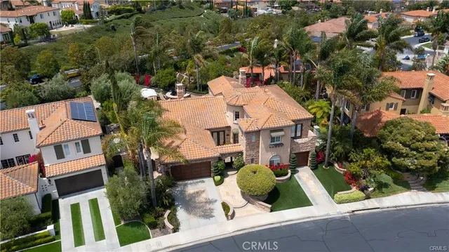 a backyard of a house with yard barbeque oven and outdoor seating