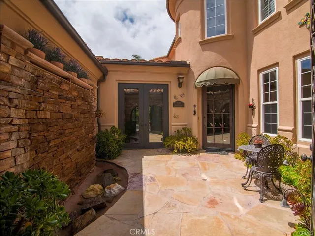 a view of a house with potted plants and a potted plant