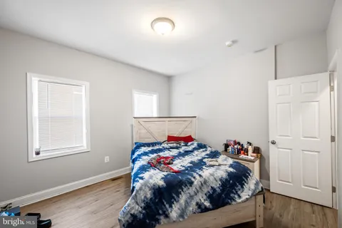 a bed room with a bed and a lamp