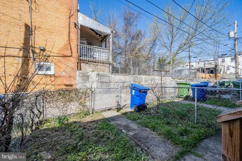 a front view of a residential apartment building with a yard