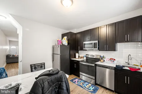 a bedroom with a bed and flat screen tv