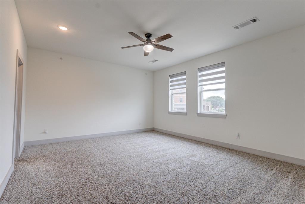 6043 Rivendell Drive Frisco, TX 75035 - Photo 24 of 38 an empty room with windows and fan