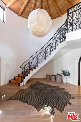 a view of a hallway view with staircase