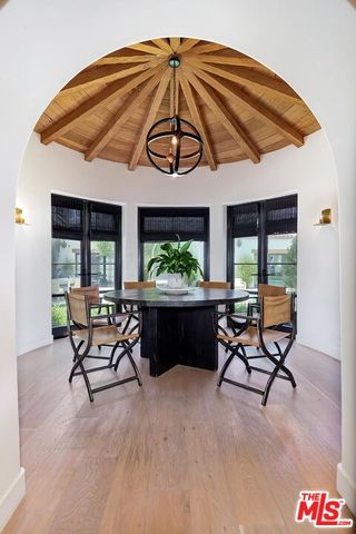 a kitchen with stainless steel appliances a sink stove and cabinets