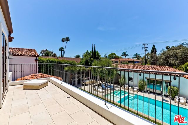 a spacious bathroom with a large tub and sink