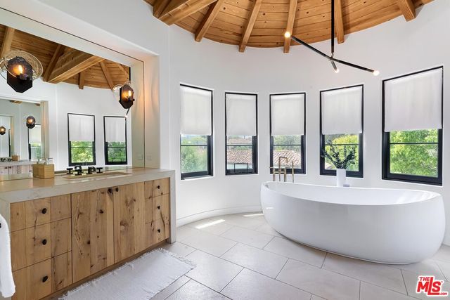 a bathroom with a bathtub and a shower