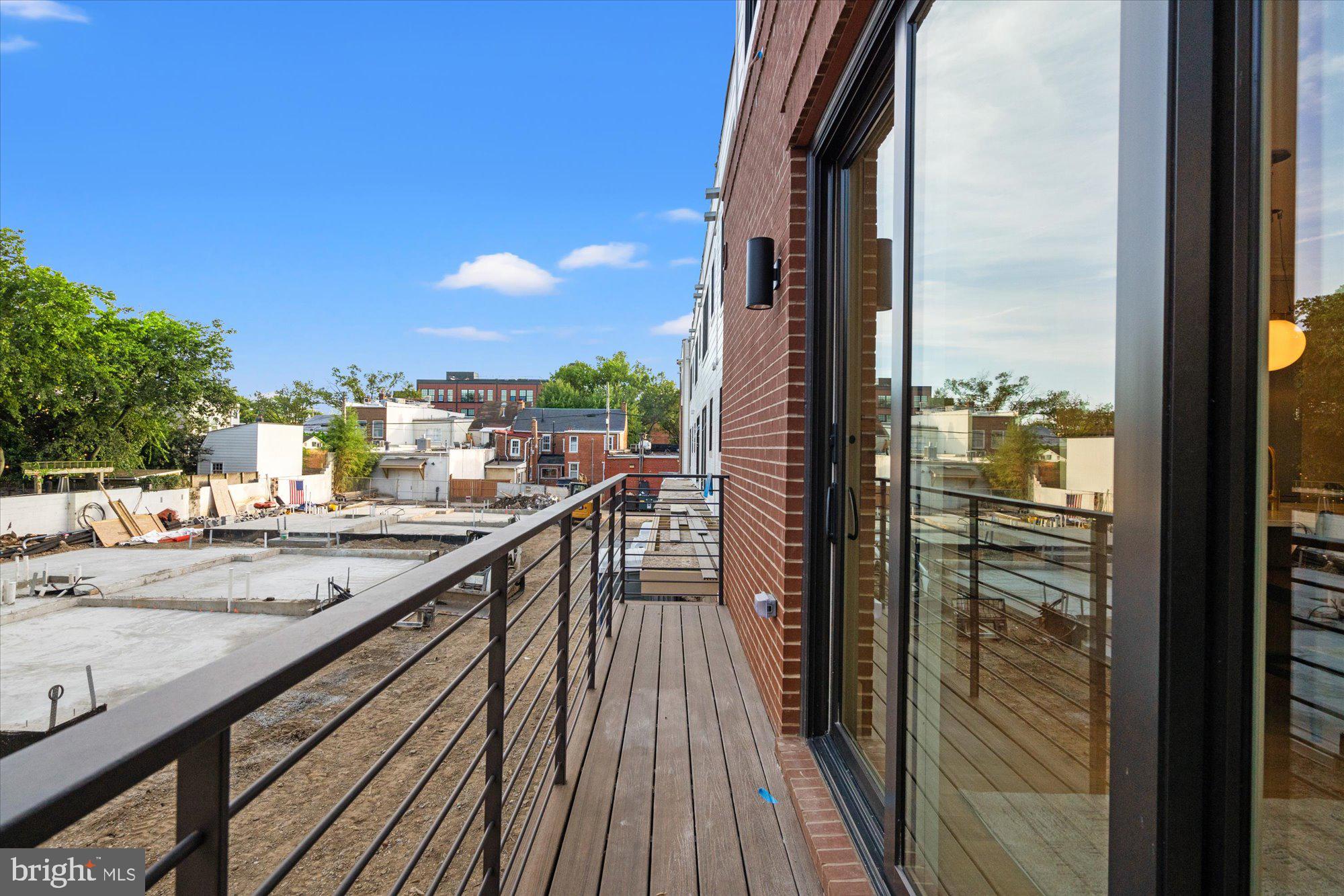 107 North West Alexandria, VA 22314 - Photo 22 of 65 a view of balcony with wooden floor and city view