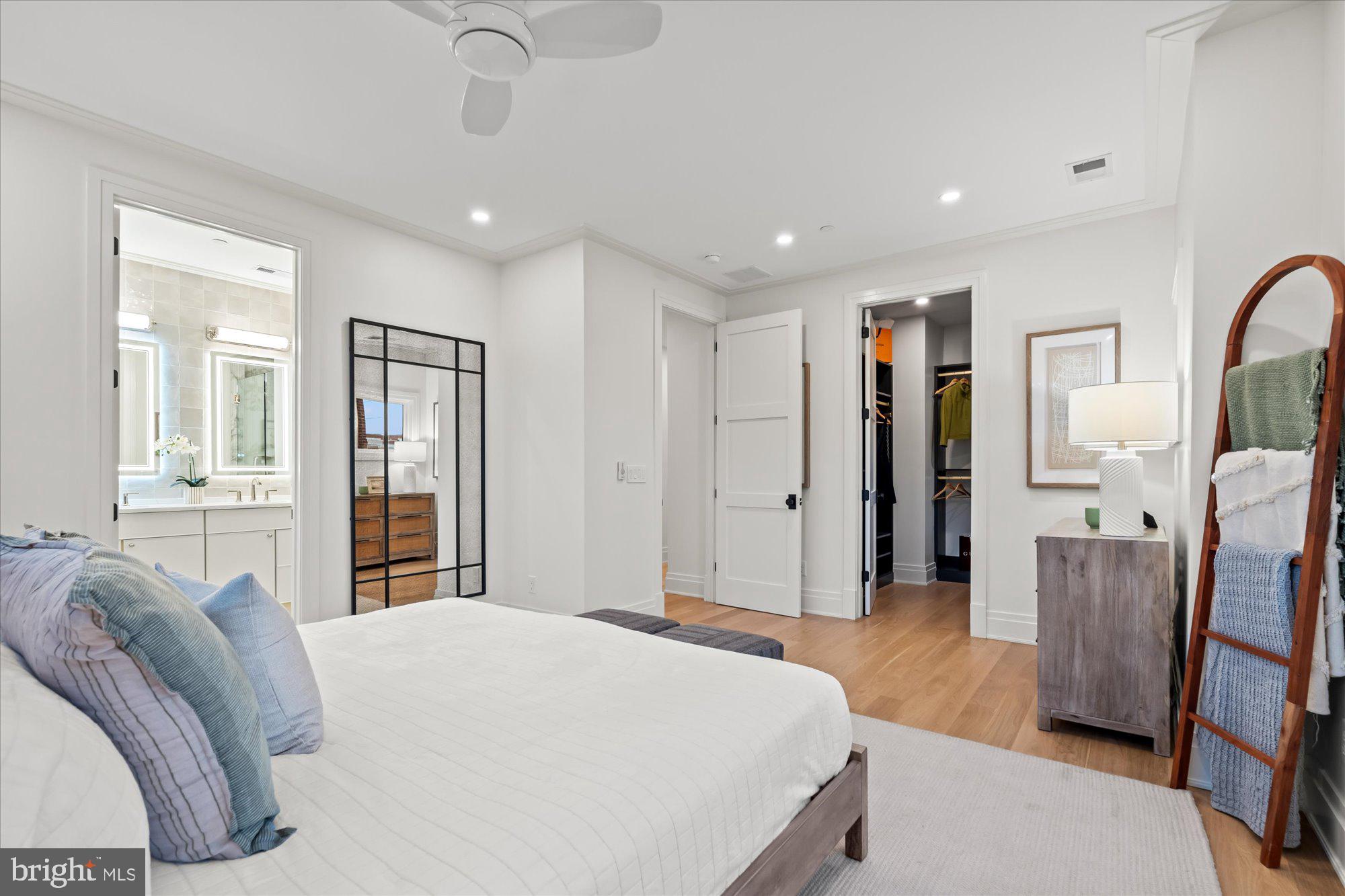 107 North West Alexandria, VA 22314 - Photo 36 of 65 a spacious bedroom with a bed and wooden floor