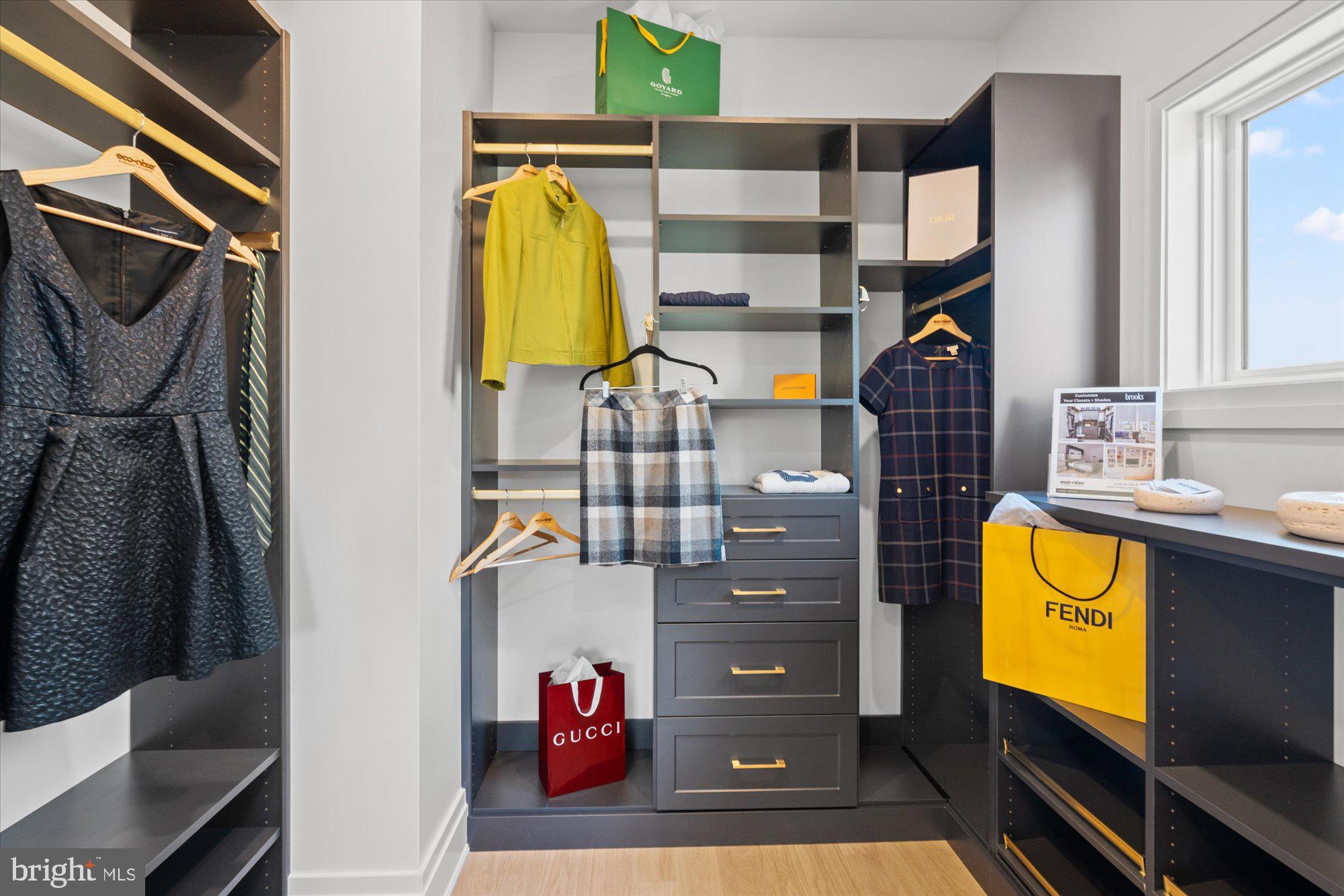 107 North West Alexandria, VA 22314 - Photo 37 of 65 a view of walk in closet with clothes and shoes