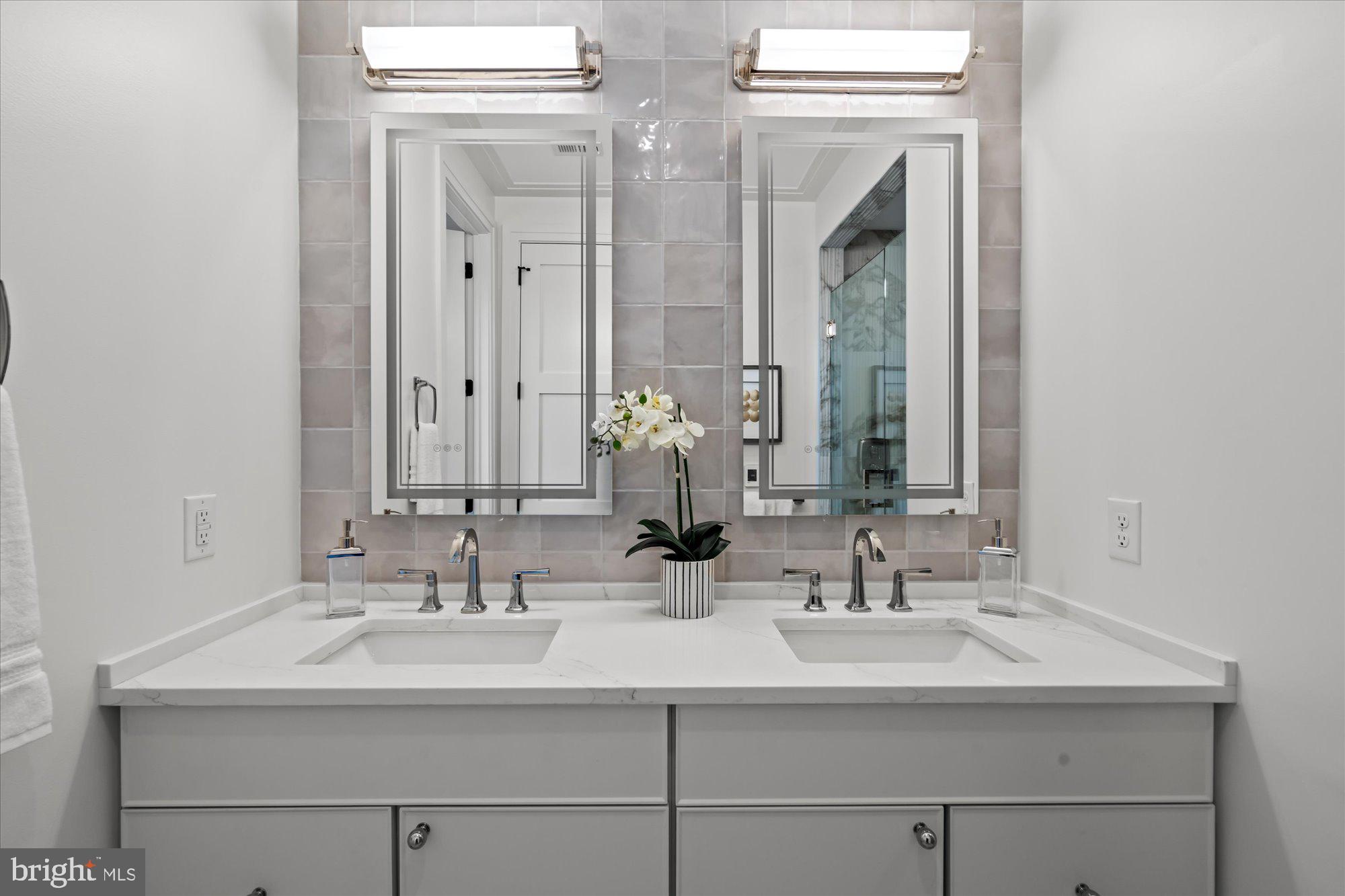 107 North West Alexandria, VA 22314 - Photo 41 of 65 a bathroom with double sink and a mirror