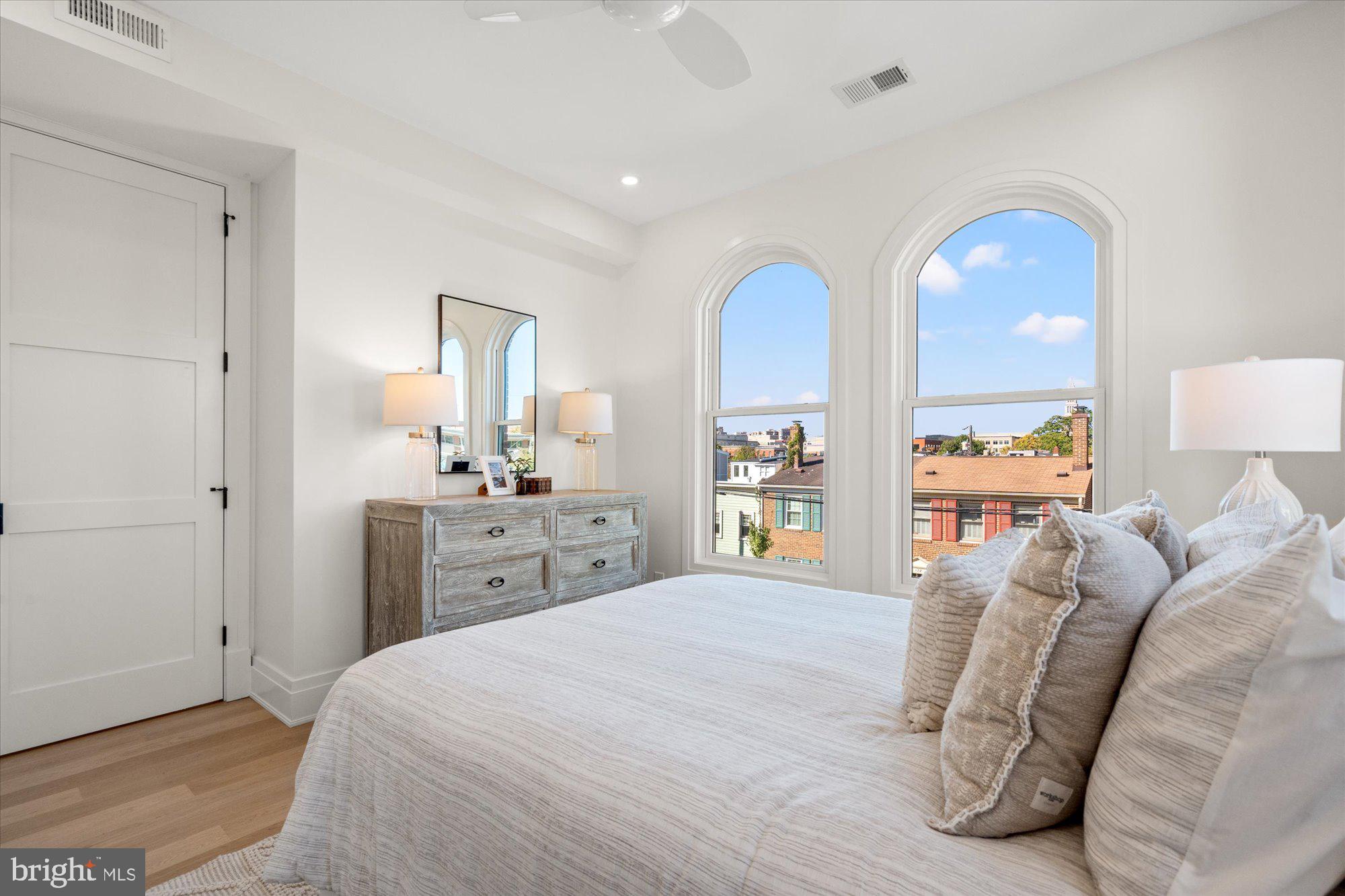107 North West Alexandria, VA 22314 - Photo 46 of 65 a en suite bathroom with a double vanity sink and a mirror