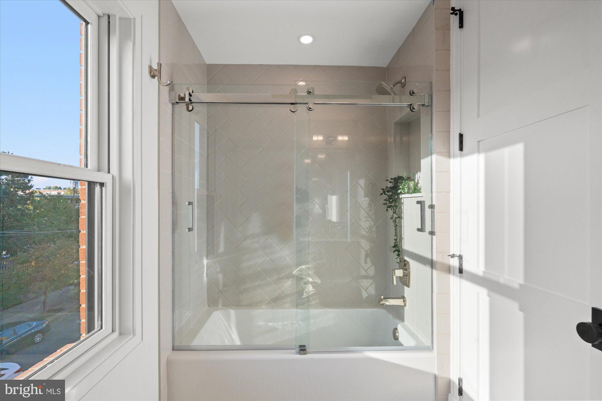 107 North West Alexandria, VA 22314 - Photo 48 of 65 a bathroom with a bathtub and a shower