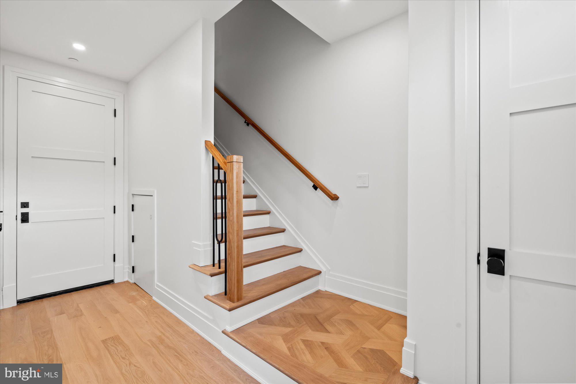 107 North West Alexandria, VA 22314 - Photo 49 of 65 a view of entryway with wooden floor and stairs