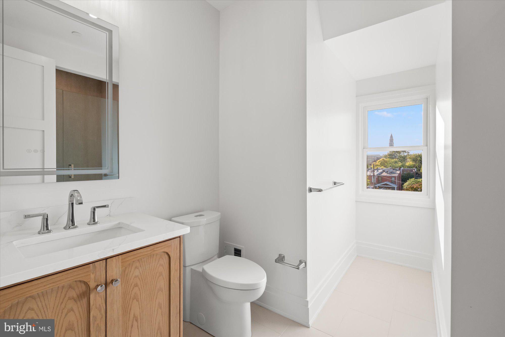 107 North West Alexandria, VA 22314 - Photo 51 of 65 a bathroom with a sink toilet and vanity
