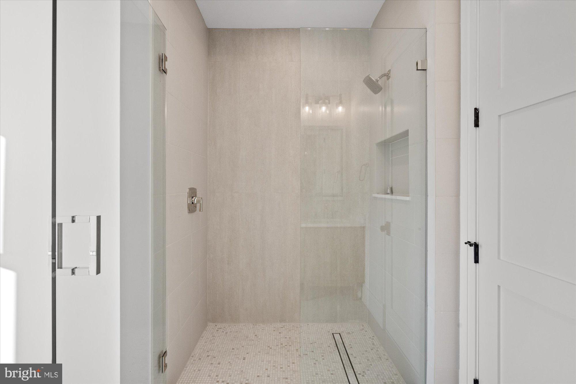 107 North West Alexandria, VA 22314 - Photo 56 of 65 a bathroom with a glass shower door