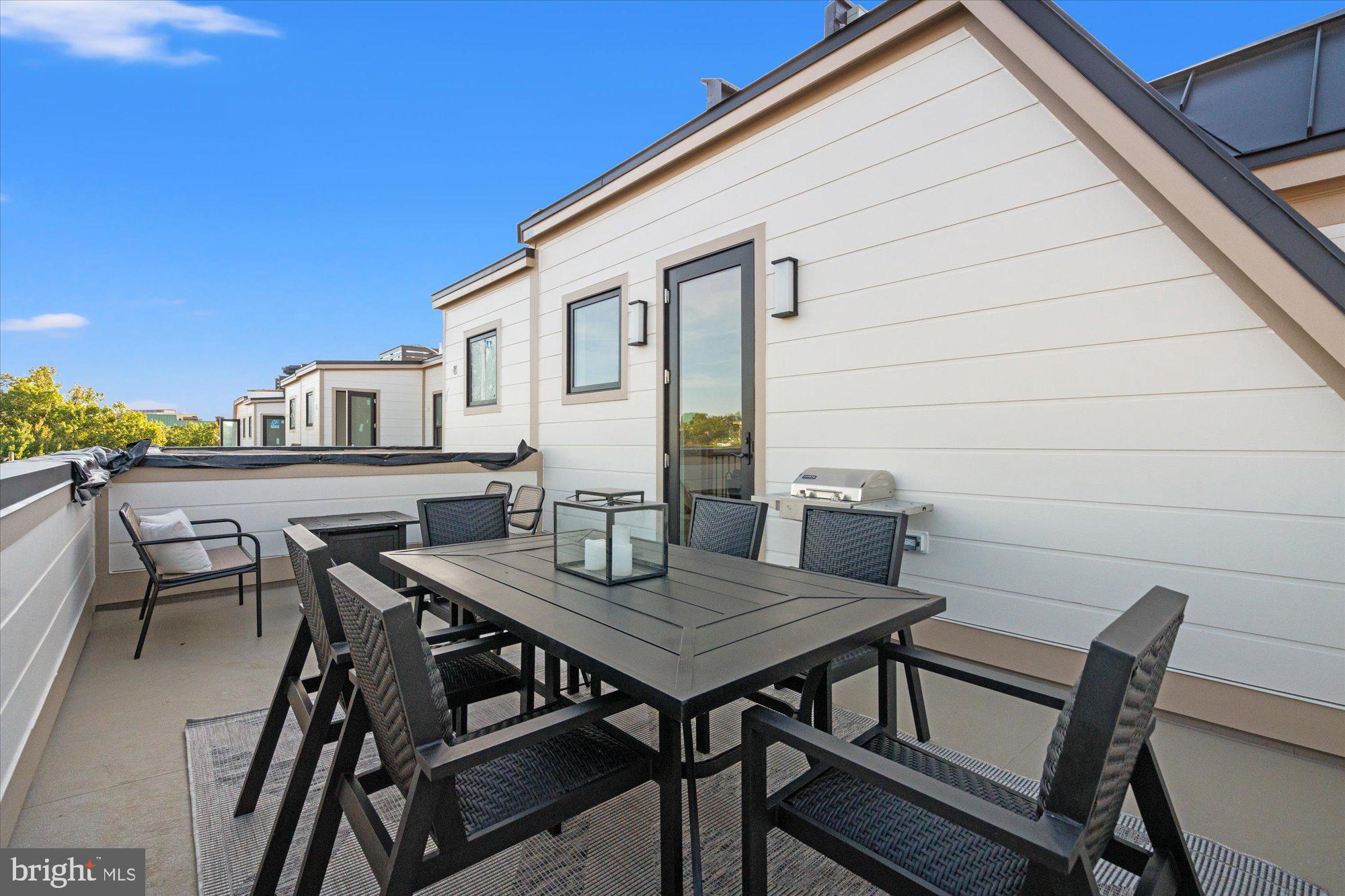 107 North West Alexandria, VA 22314 - Photo 64 of 65 a view of a patio with table and chairs and potted plants