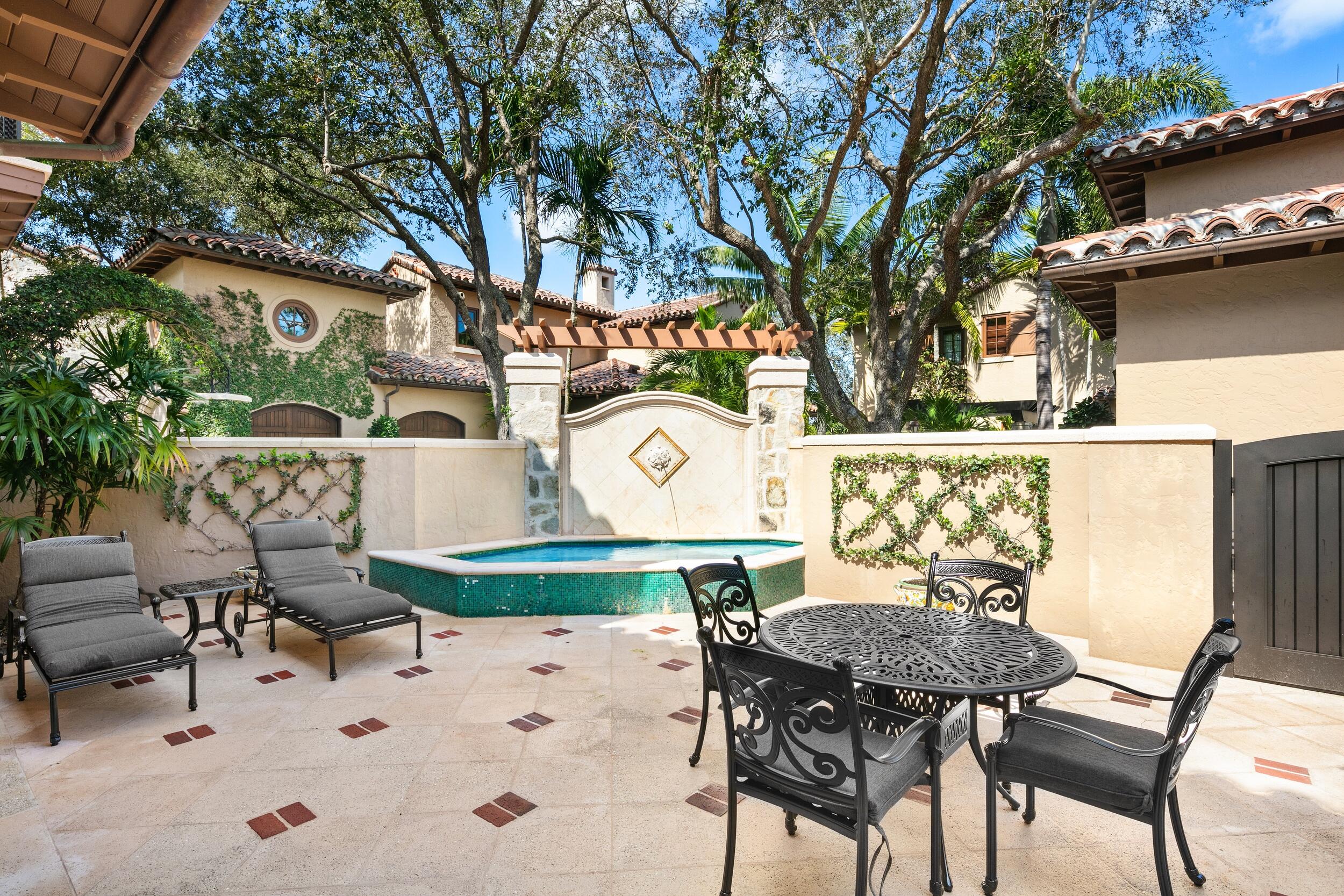 306 Villa Drive Jupiter, FL 33477 - Photo 23 of 30 a view of a chairs and table in patio