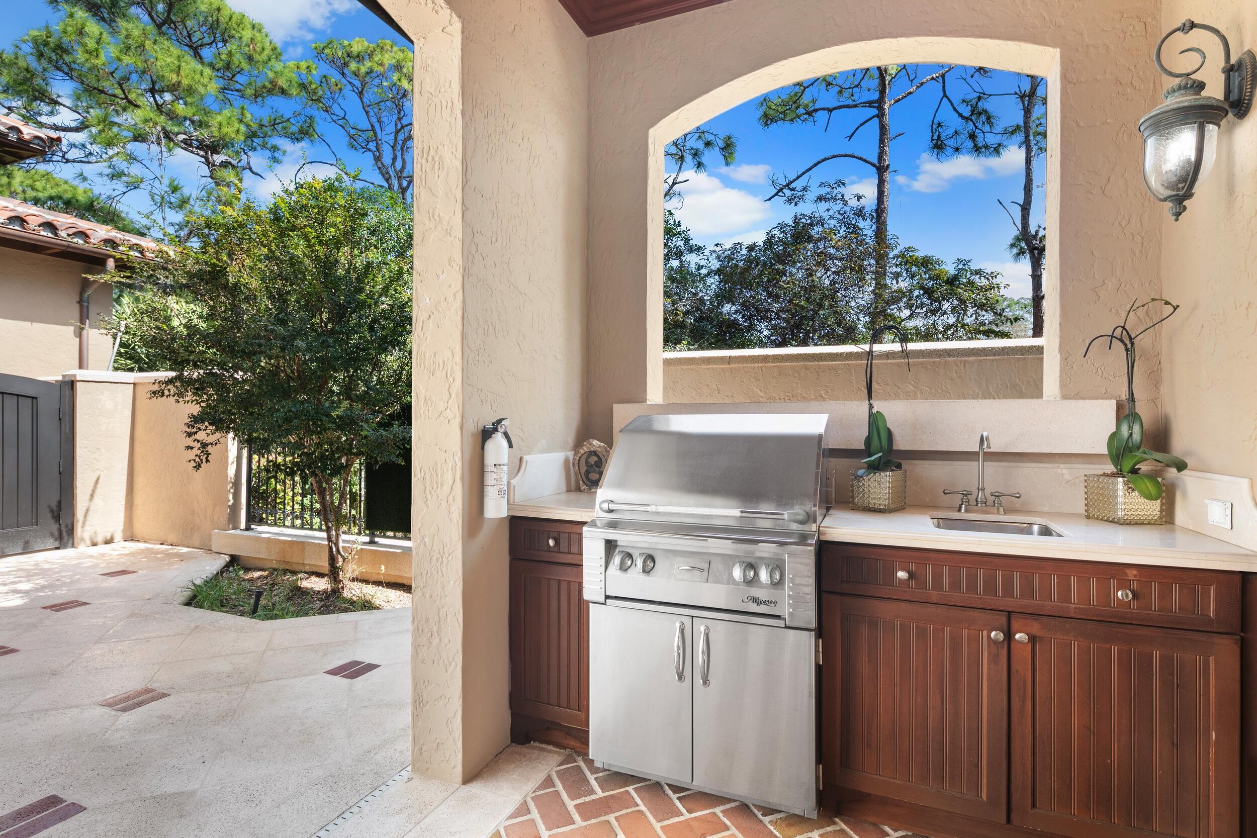 306 Villa Drive Jupiter, FL 33477 - Photo 24 of 30 a kitchen with a sink and cabinets