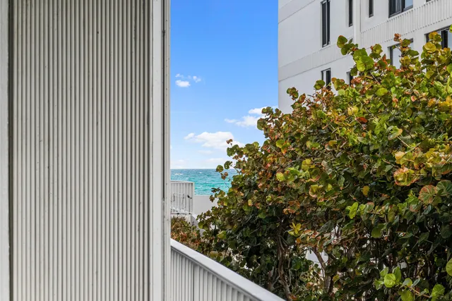 a city street lined with buildings and cars