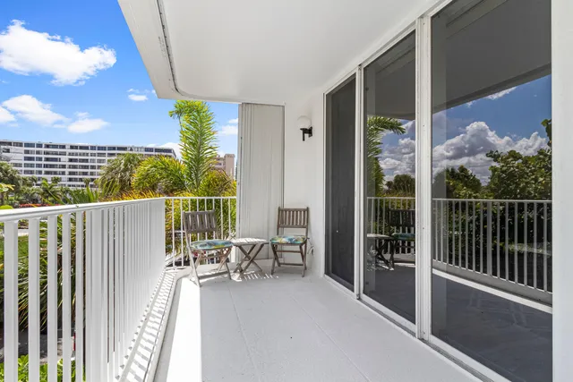a balcony with with a potted plant and outdoor space