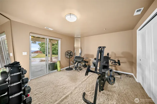 a view of a room with gym equipment