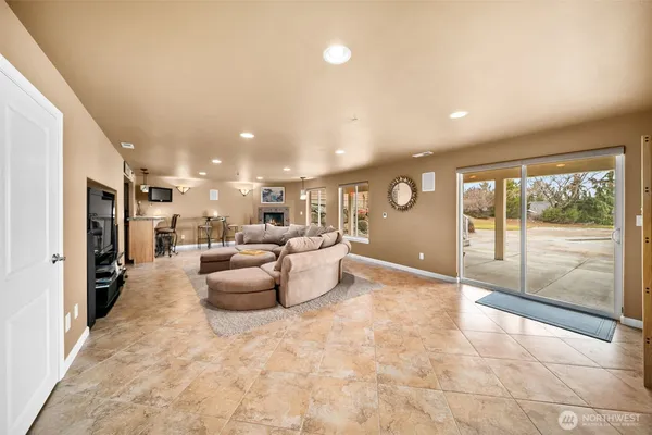a living room with furniture and a large window