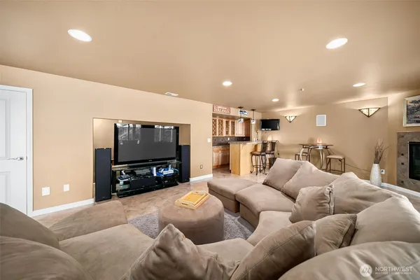 a living room with furniture and a flat screen tv